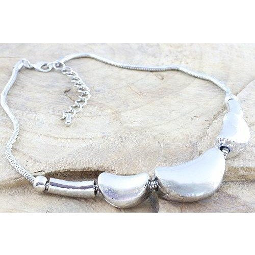 Chunky solid metal crescent nuggets in a polished finish and presented on a snake chain-0