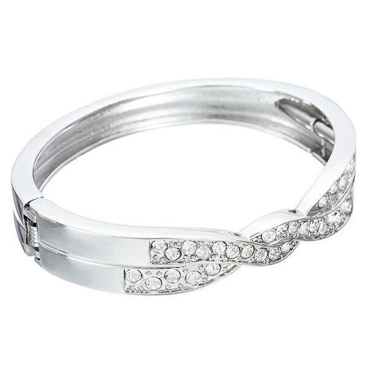 Spring-loaded twist design bangle/cuff with rhinestone detail in a highly polished finish.-0